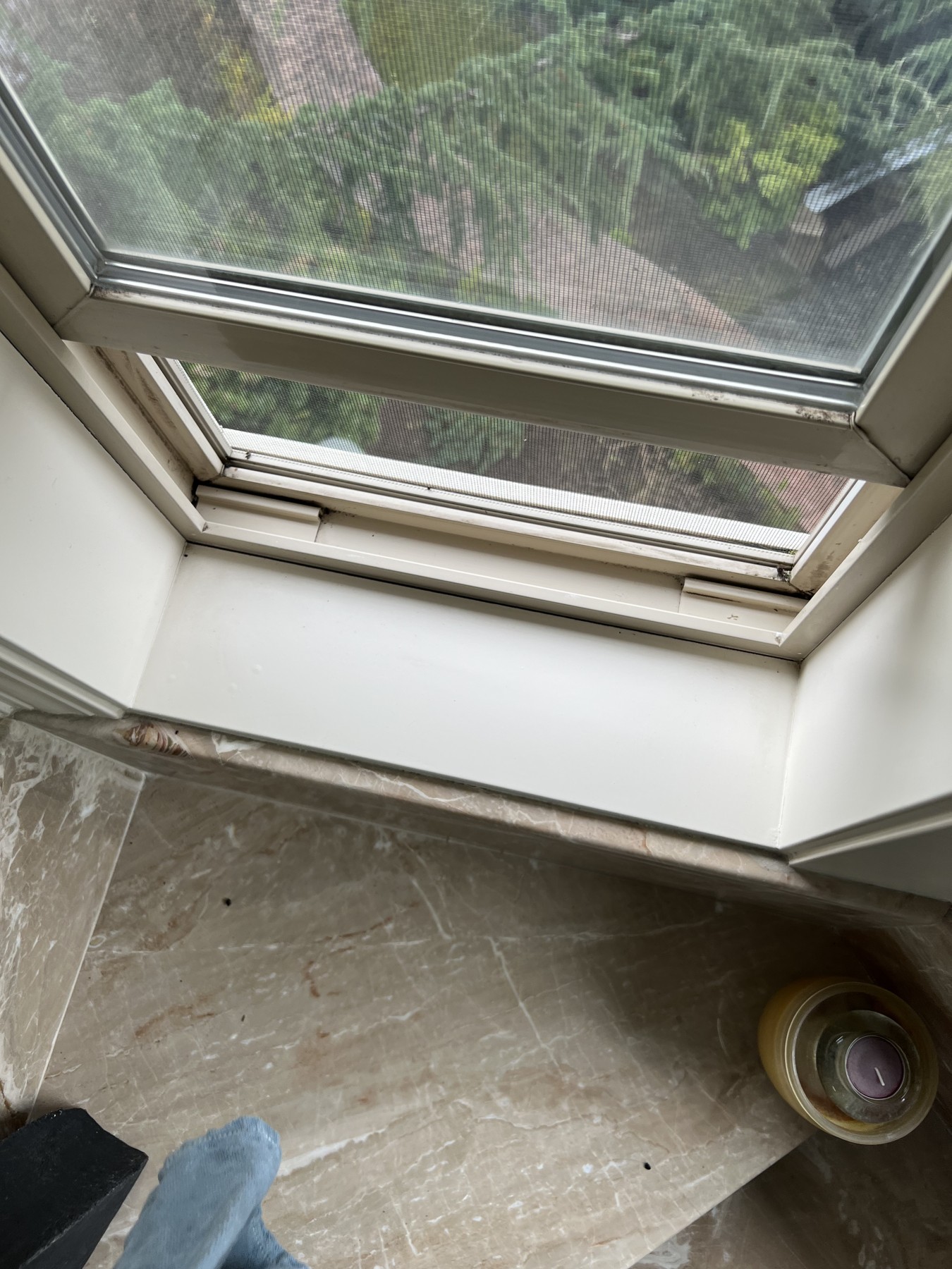 The same window track after cleaning, with the dirt removed